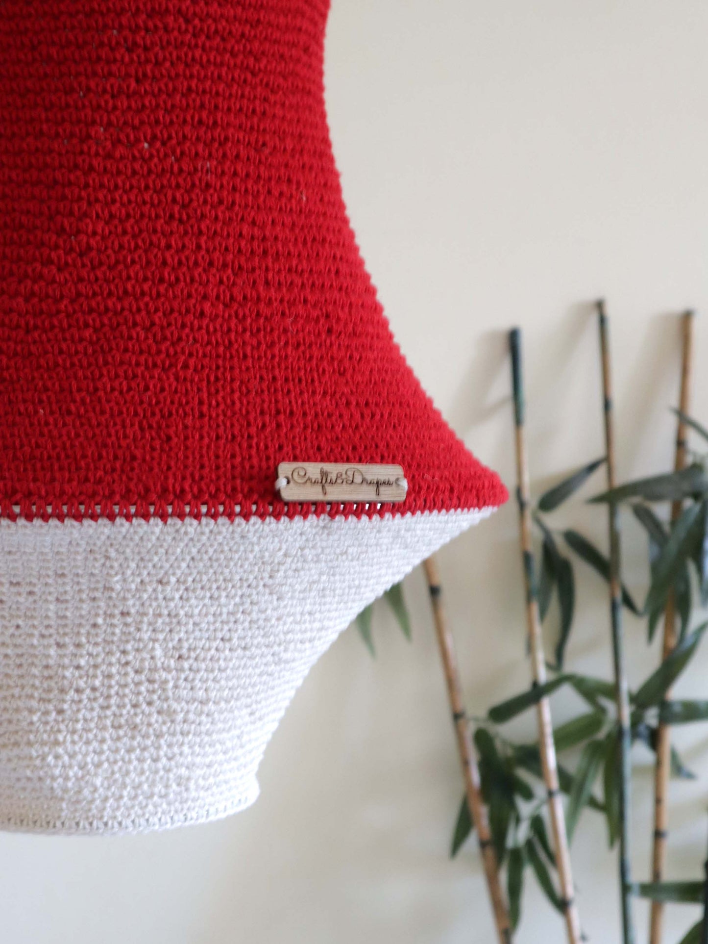  "Artisan-made handwoven red and ivory crochet light.