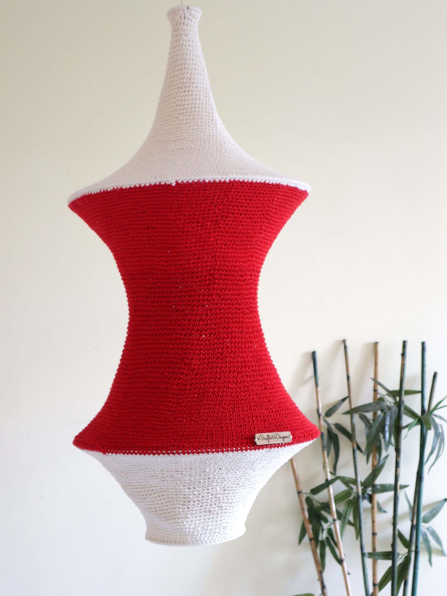  "Artisan-made handwoven red and ivory crochet light.