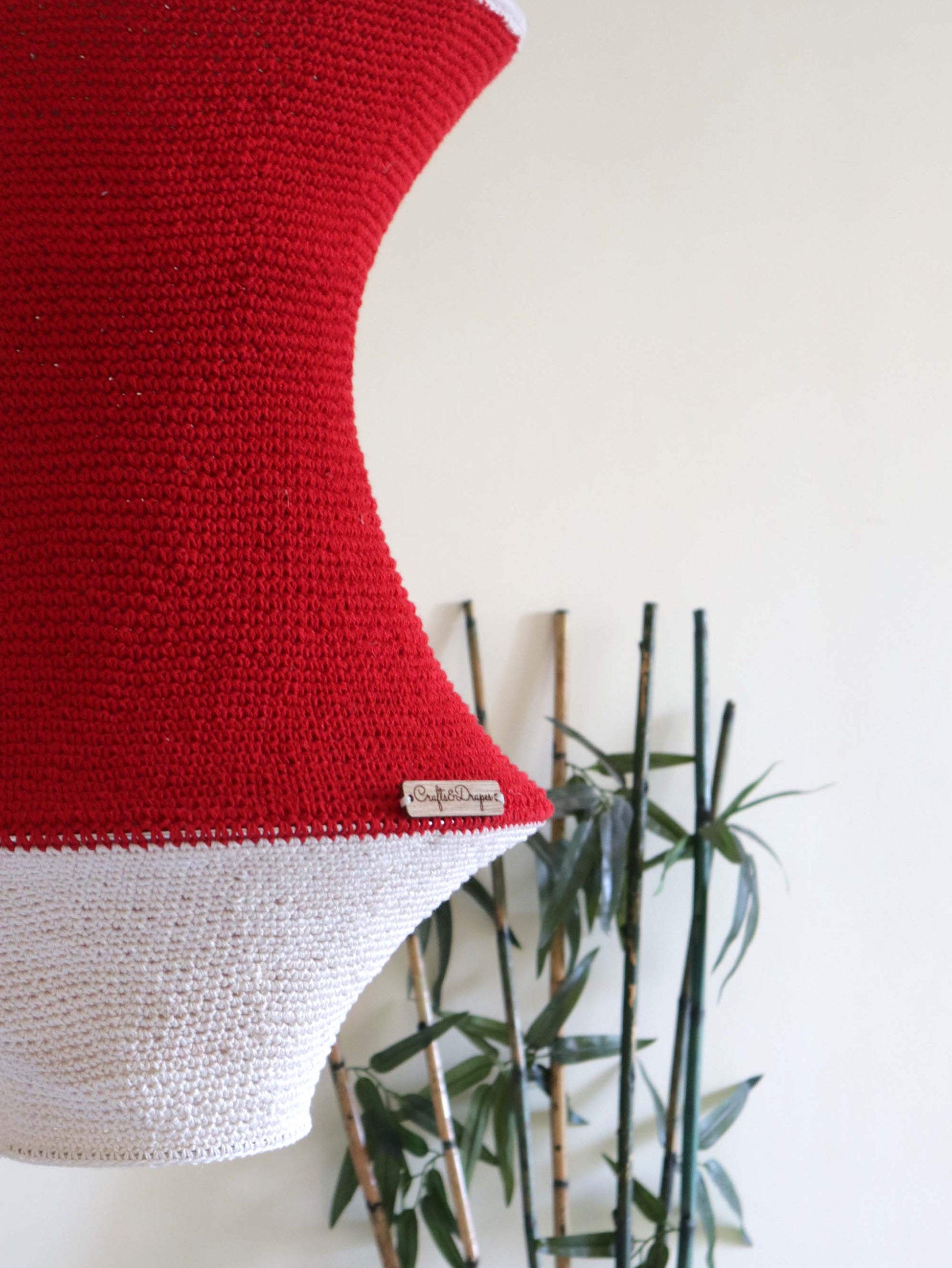  "Artisan-made handwoven red and ivory crochet light.