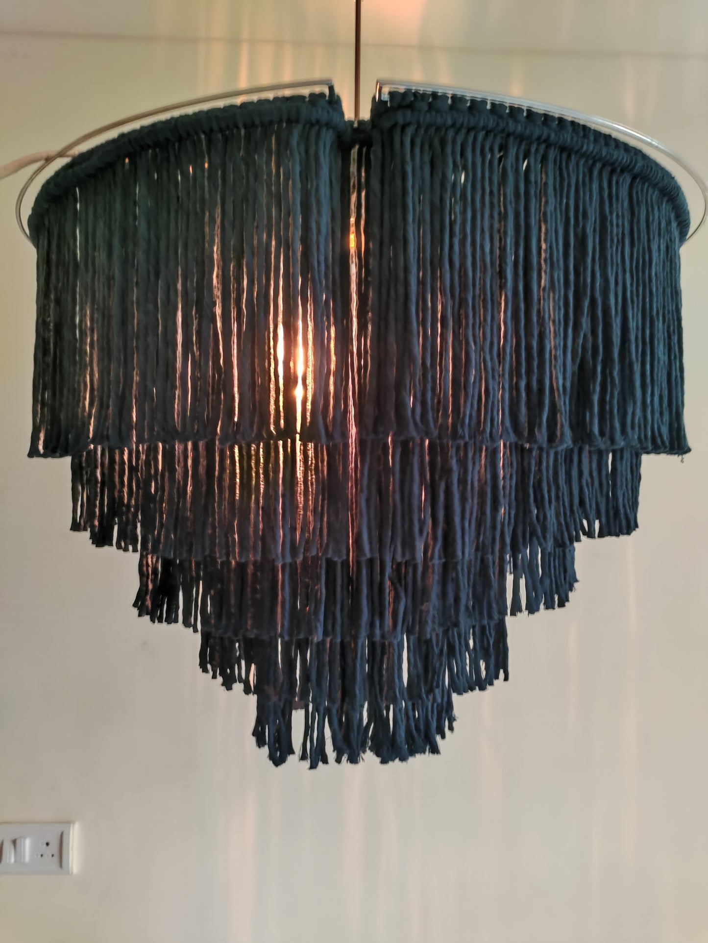 Handcrafted macramé labyrinth chandelier, adding texture and warmth to your space.